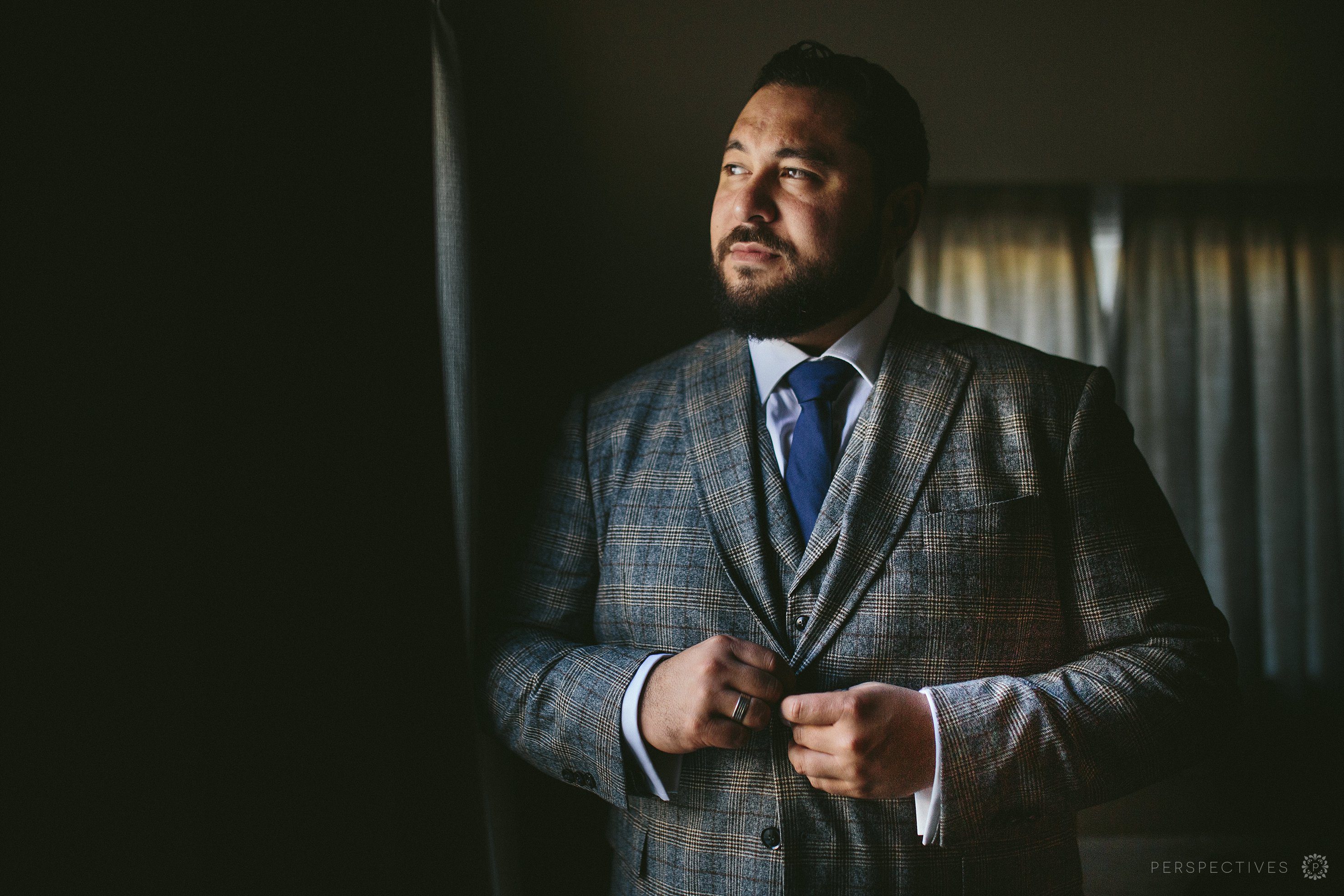 Groom looking towards light
