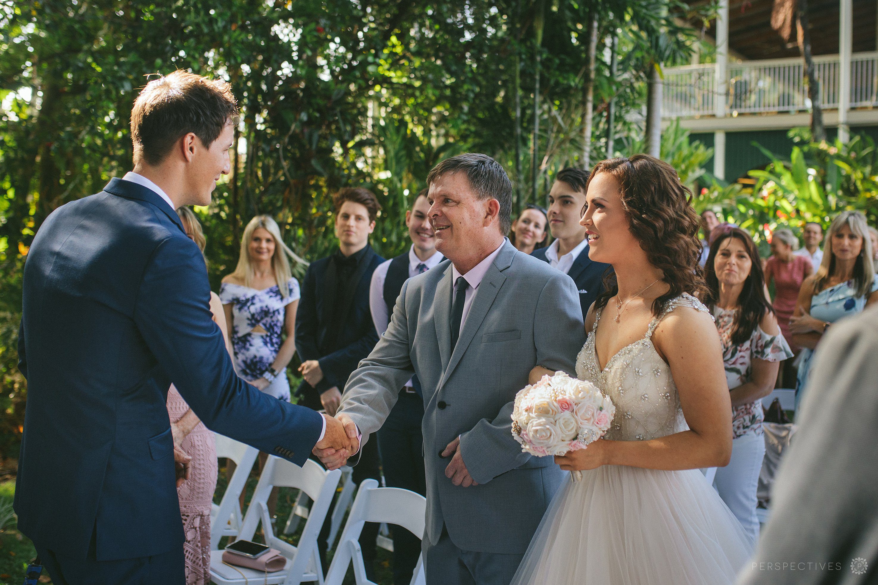 Bride and father in aisle