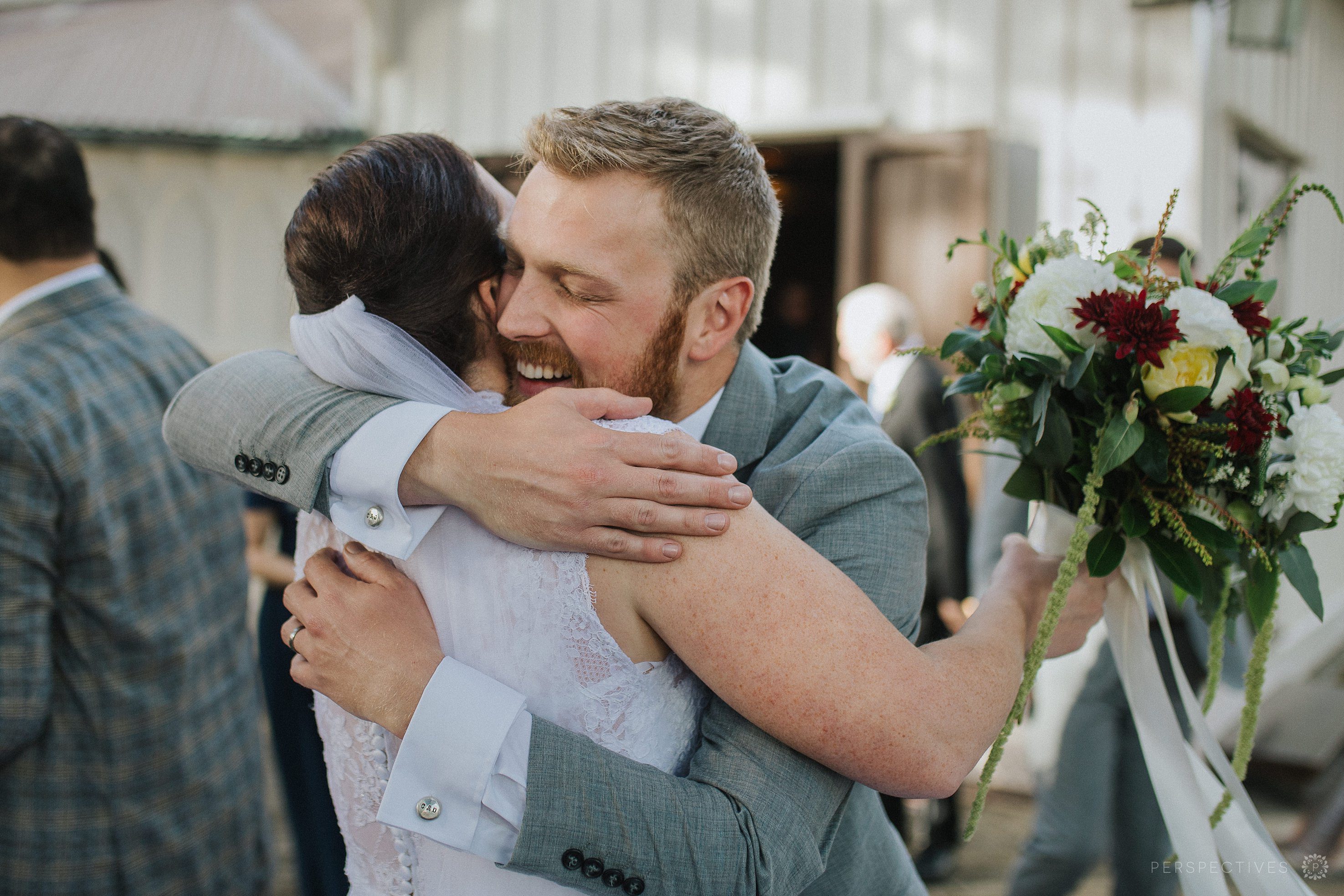 Guest hugs bride after wedding