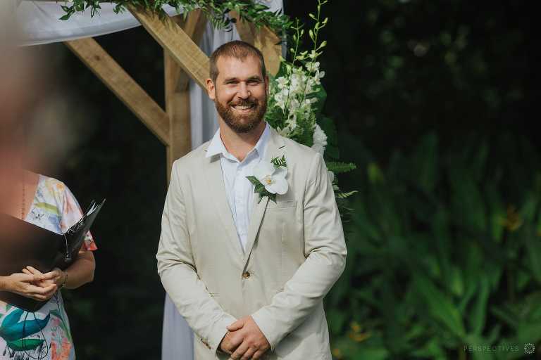 Cairns backyard wedding photos - groom in aisle