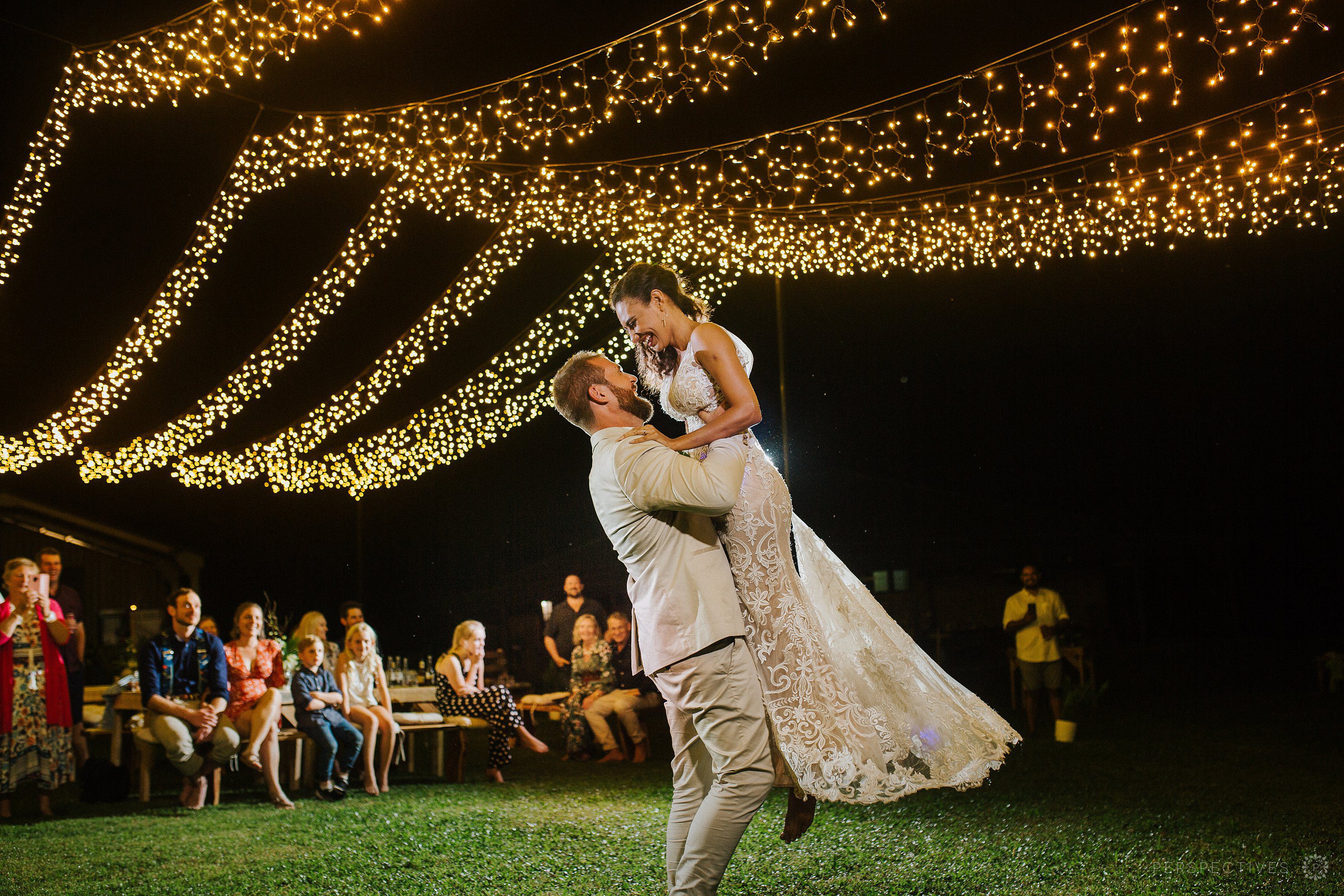 Wedding photos first dance under fairy light canopy Cairns