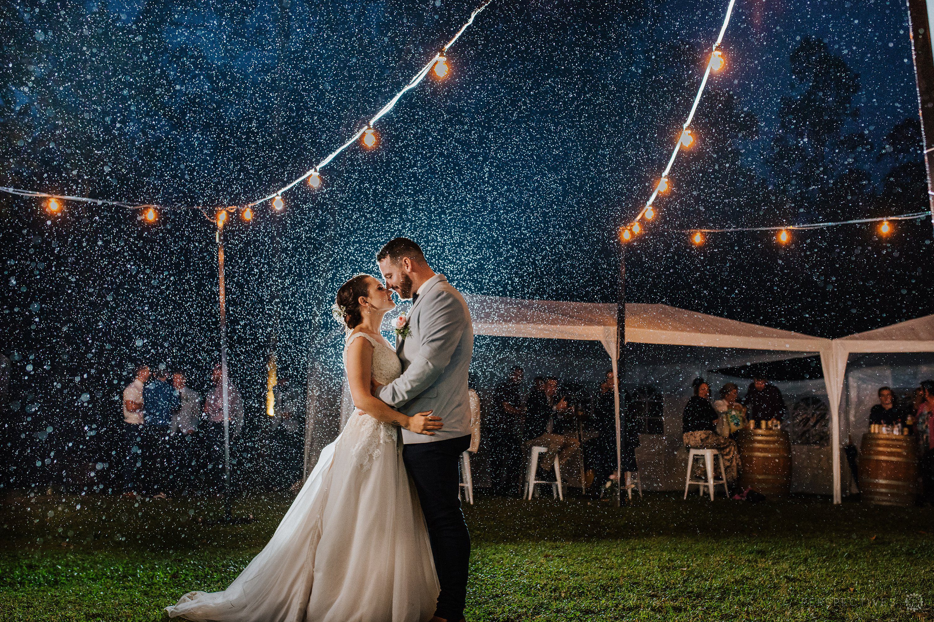 Backlit rain wedding photos romantic Cairns Queensland