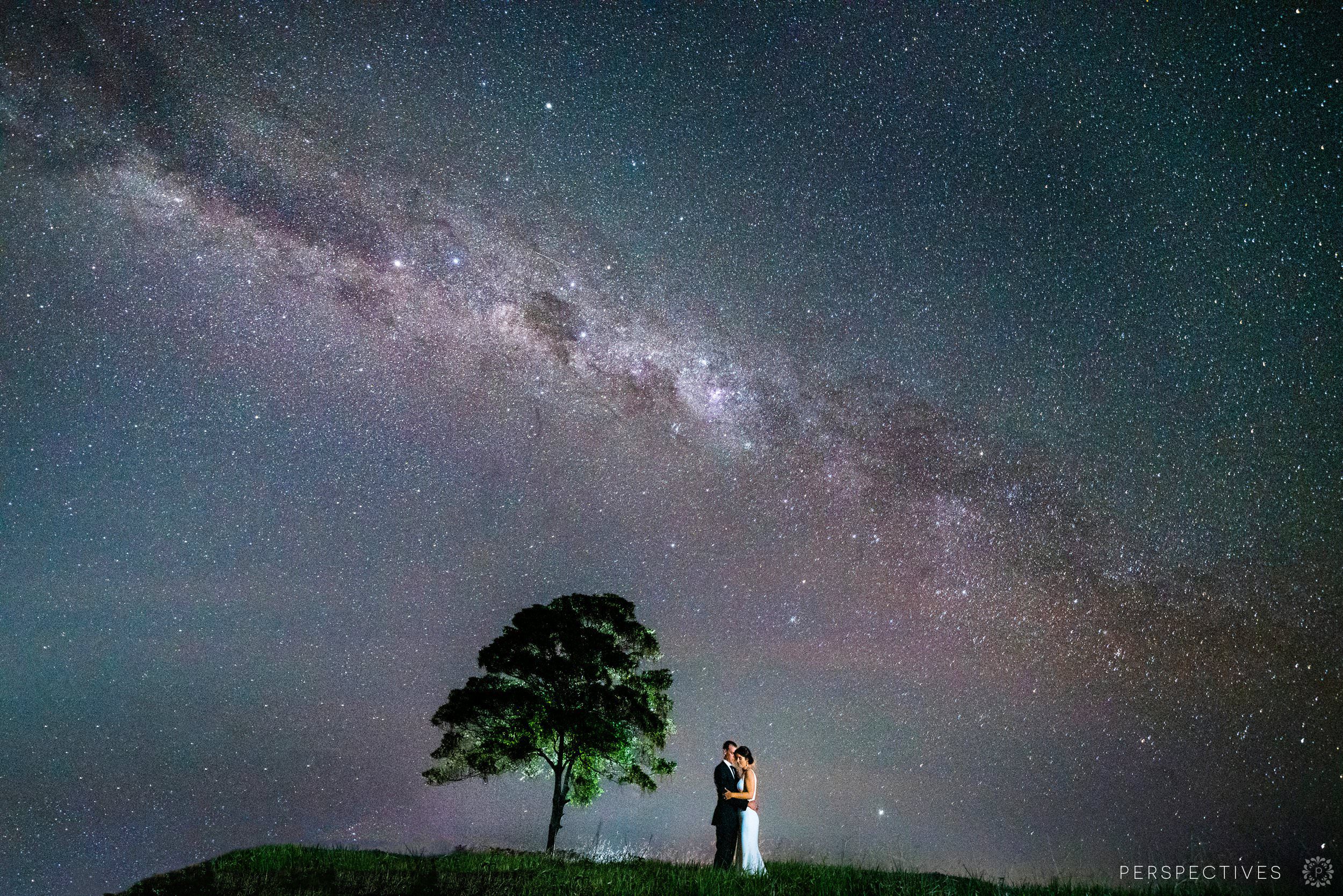 Epic star photo wedding bride & groom under Milky Way with tree