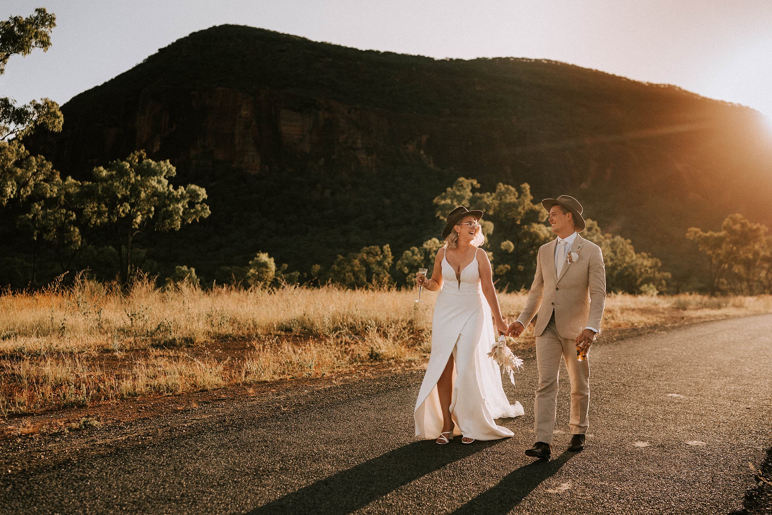 Wedding couple walking down road at Mount Mulligan lodge