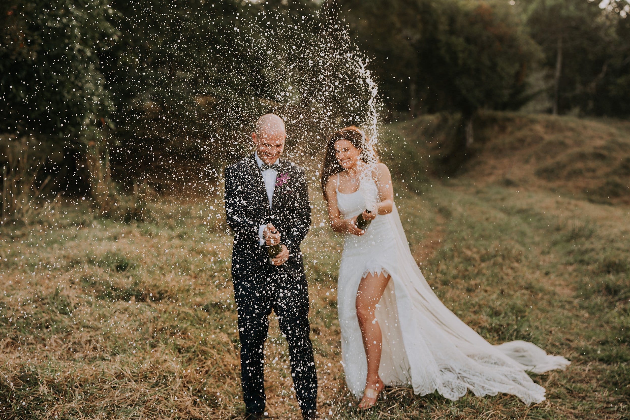 Champagne spray wedding photos