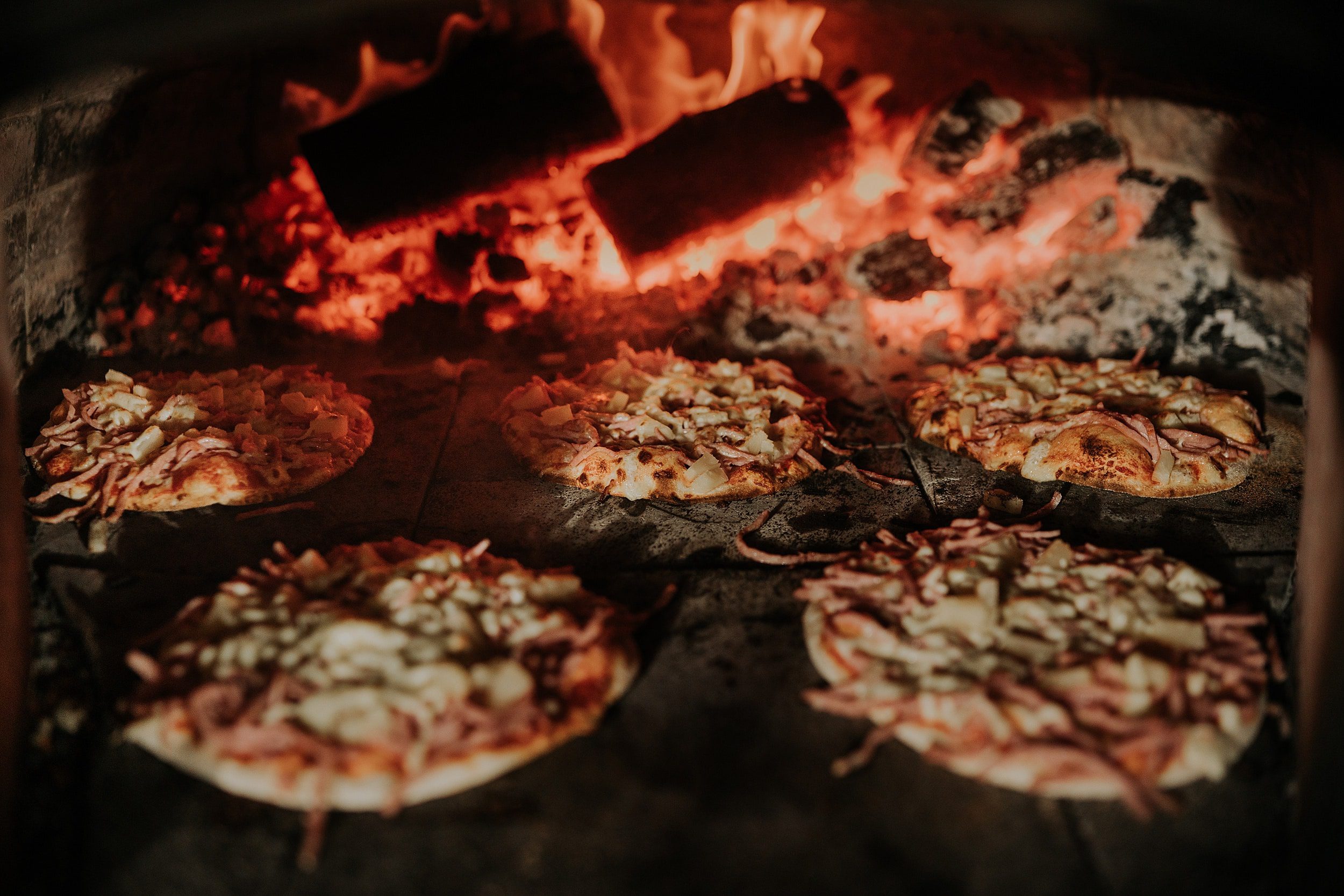 Woodfired pizzas cooking for wedding reception at Mount Quincan