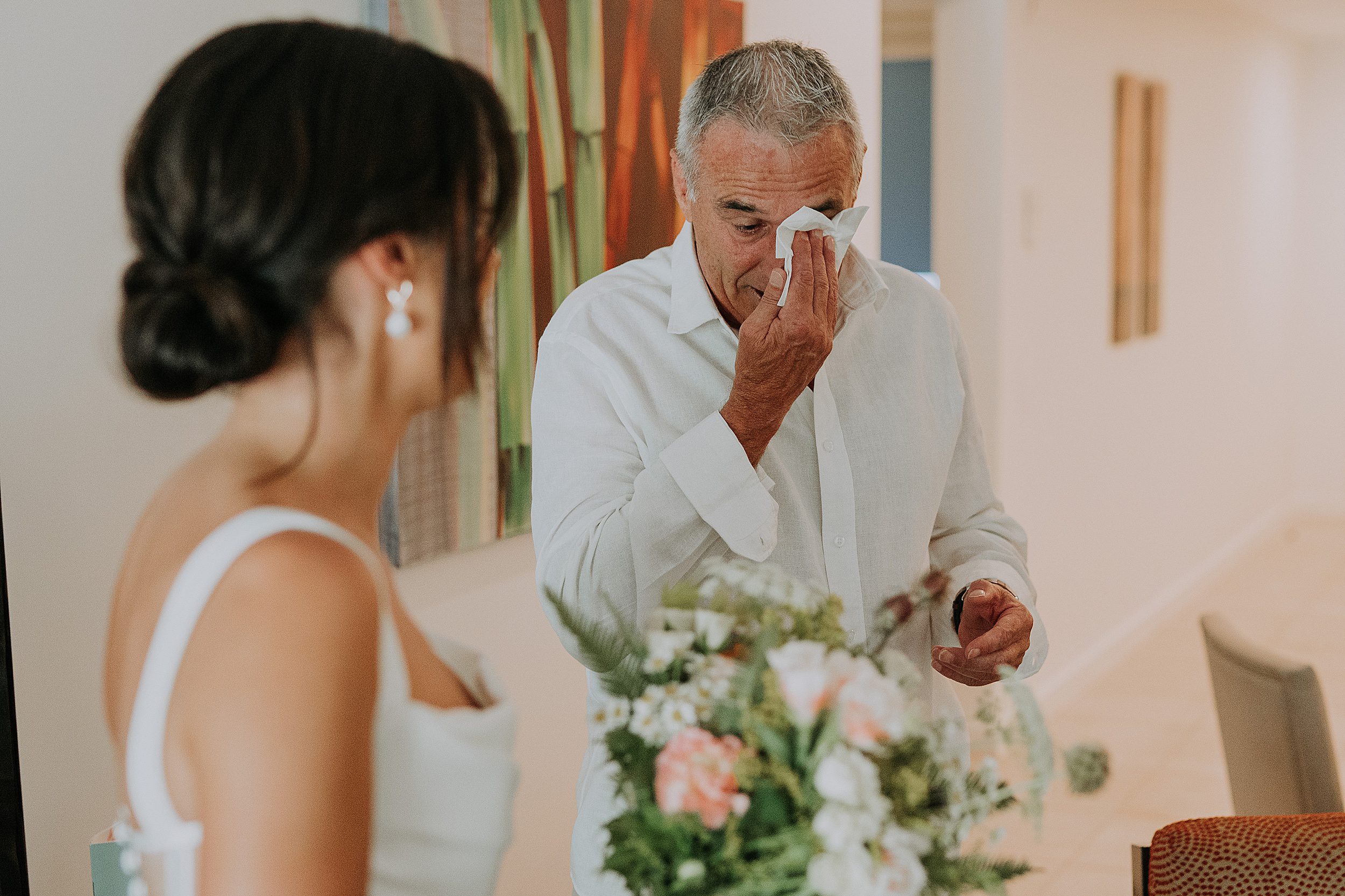 Bride's dad seeing her in dress wedding photo